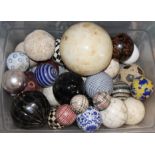 A quantity of china spheres, various, including three Victorian carpet balls
