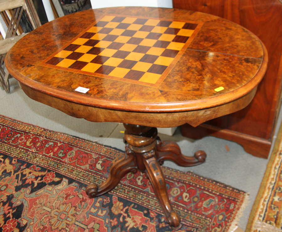 A Wilkinson and Son patent 19th century figured walnut and inlaid oval games table with reversible