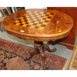 A Wilkinson and Son patent 19th century figured walnut and inlaid oval games table with reversible