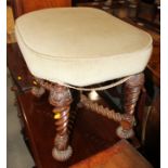 A 19th century carved walnut stool of Restoration design, on spiral turned supports united by barley