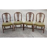 Four George III design standard dining chairs with stuffed over seats, on square taper stretchered