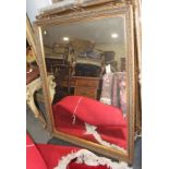 A gilt framed rectangular wall mirror, plate 31 1/4" x 43"