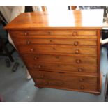 A collector's late 19th century satin birch chest of seven long graduated drawers, on turned
