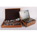 A canteen of silver plated cutlery and a walnut and Tunbridge banded writing box with mother-of-