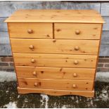 A pine chest of two short and four long drawers, on block base, 35" wide x 15" deep x 36" high
