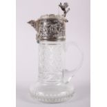 A white metal mounted cut glass claret jug, stamped Topazio, 11" high