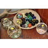 Three bubble glass door stops and a quantity of coloured glass balls