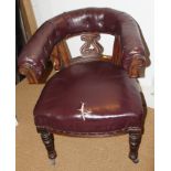 An early Victorian carved walnut library chair with pierced splat back, button upholstered in a