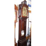 A late Georgian mahogany long case clock with arch top dial, silver chapter ring, date window and