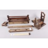 A pair of Victorian rosewood bookends (damages), an ivory page turner and loose pieces of wood