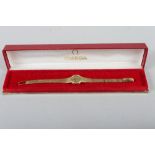 A lady's Omega 18ct textured gold wristwatch and bracelet, 26.2g gross, in case (no winder)