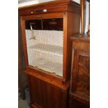 A 19th century pitch pine office unit with tambour shutter over cupboards, 33"wide