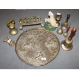 Four brass bells, a door stop, in the form of a duck, a paperclip, two weights and a Middle