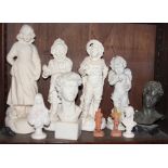 A 1920s plaster figure of a girl with a rabbit, 16" high, and a collection of other figures