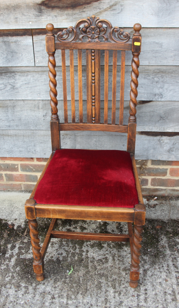 A Victorian mahogany loop back side chair with leather stuffed over seat, on turned supports, and