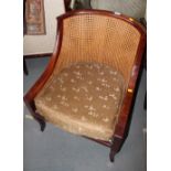 A Chinese hardwood showframe double bergere cane back chair