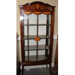 An Edwardian mahogany and inlaid display cabinet enclosed lattice glazed door, on splay supports, 29