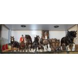 A Beswick model of a horse with jockey and other model horses and carriages