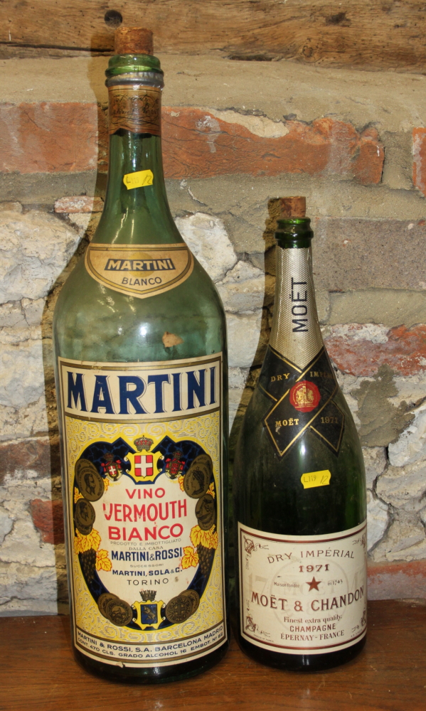 An over-sized Martini bottle, 20" high, and a Moet Chandon magnum champagne bottle