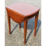 A Bright's of Nettlebed mahogany and banded oval drop leaf occasional table, on square taper