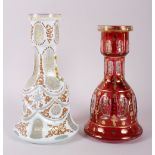 A 20th century Bohemian ruby glass mallet-shaped vase with gilt decoration, 10" high, and a