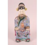 A Canton enamel figure of the God of Fortune, 10" high (restorations)