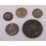 A George IV silver crown, dated 1821, a George III sixpence, dated 1787 (holed), a George III silver