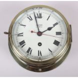 A Smiths Astral bulkhead clock with Roman numerals, in brass case, 6 3/4" dia