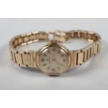 A lady's Omega 9ct gold wristwatch and bracelet, 18.2g gross