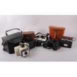 A pair of Zenith field 7.1 7x50 binoculars, a pair of Wraystar 8x40 binoculars, a Zeiss Icon