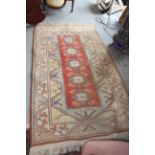 A Kazak type rug with rust centre ground and geometric borders, 79" x 46" approx, a kelim rug with