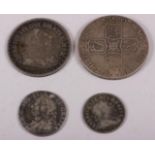 A Queen Anne silver crown, dated 1707, a George II silver shilling, dated 1745 (holed), a George III