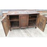 A panelled oak coffer, now converted as a cupboard with two doors, constructed from 17th and 18th