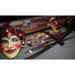 A pair of Indonesian carved wood deity wall hangings, a clown mask, a Chinese pilgrim flask and
