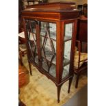 An Edwardian mahogany and line inlaid display cabinet enclosed two ash glazed panel doors, on square