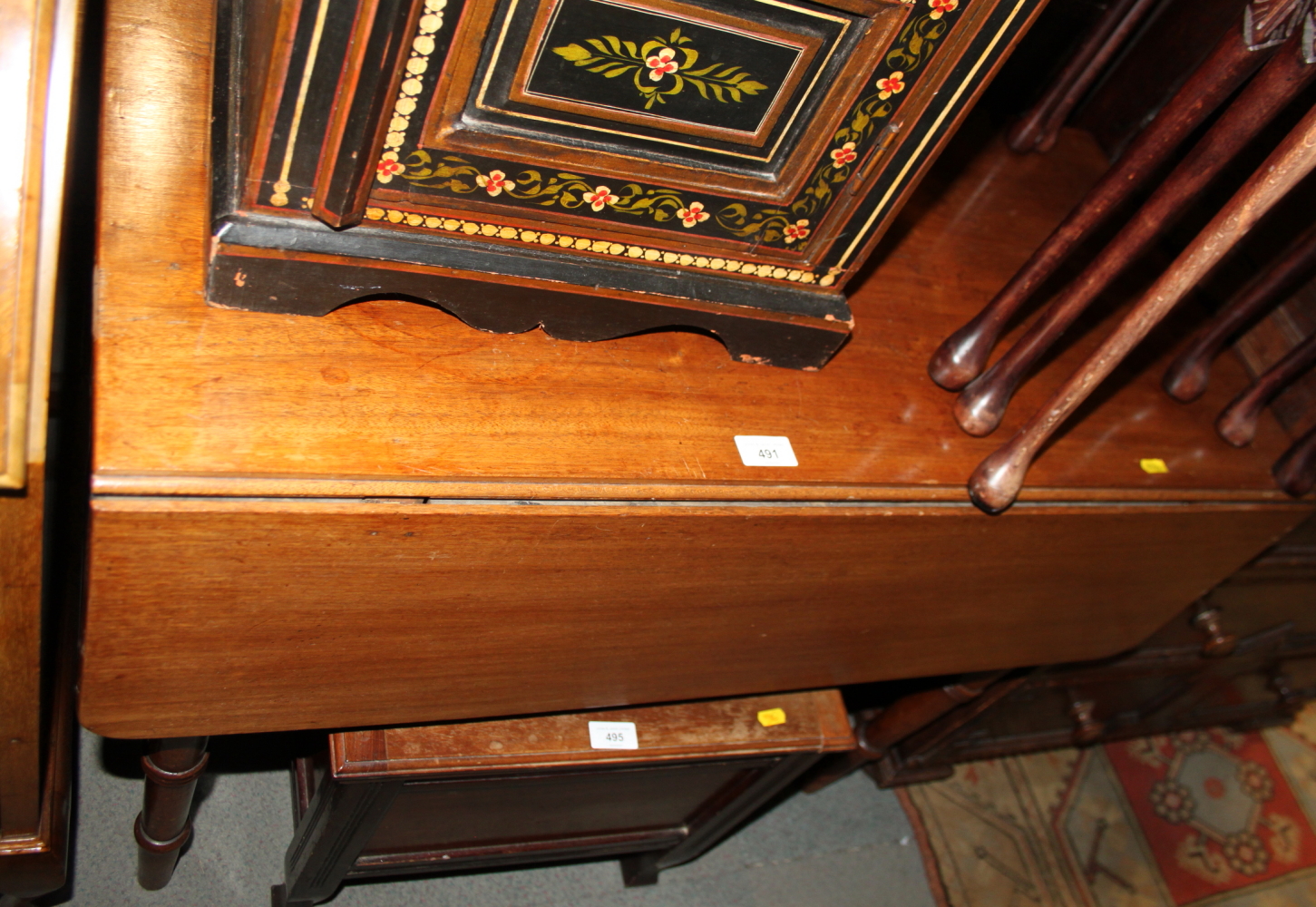 A 19th century mahogany Pembroke table, on turned and tapering supports, 36" long x 37" wide x 28