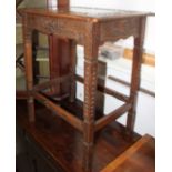 An early 20th century chip carved oak occasional table, on stretchered supports, 22" wide x 15" deep