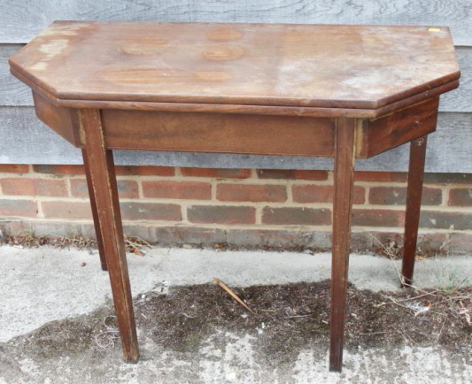 A late Georgian padouk fold-over top tea table, on moulded square taper supports, 38" wide x 18"