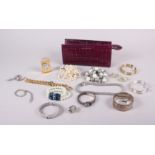 An Aspinal of London purple leather stationery case and a quantity of costume jewellery, including a