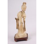 A Chinese "Tang" pottery figure of a dancer in flowing robes, 14 1/2" high, on wooden base (