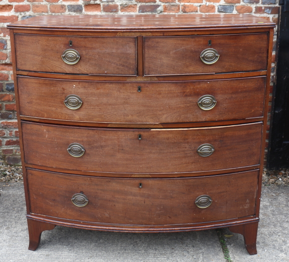 A Victorian mahogany bowfront chest of two short and three long graduated drawers, on splay