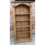 A pine open bookcase with flanking columns and four shelves, 39" wide x 16" deep x 74" high