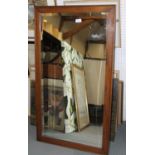An oak framed wall mirror with bevelled plate, 19 1/2" x 38 1/4"