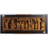 A Chinese carved wooden wall plaque, decorated gilt figures, in high relief, in black strip frame, 9