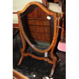 A late 19th century mahogany and box strung shield-shaped swing frame toilet mirror, on skeleton