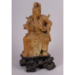A Chinese soapstone carved figure of an immortal, 11 1/2" high