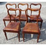 A set of five William IV mahogany kidney shaped bar back standard dining chairs with leather drop-in