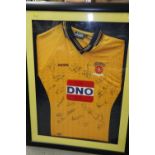 A signed Hartlepool United FC football shirt, in black strip frame