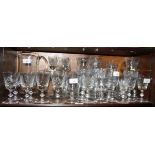 A quantity of table glasses, including wines, scotch and tumblers, a lemonade jug and a tazza