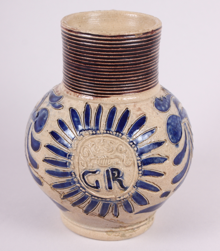 An early 18th century German stoneware jug with GR monogram, 5" high (restored)